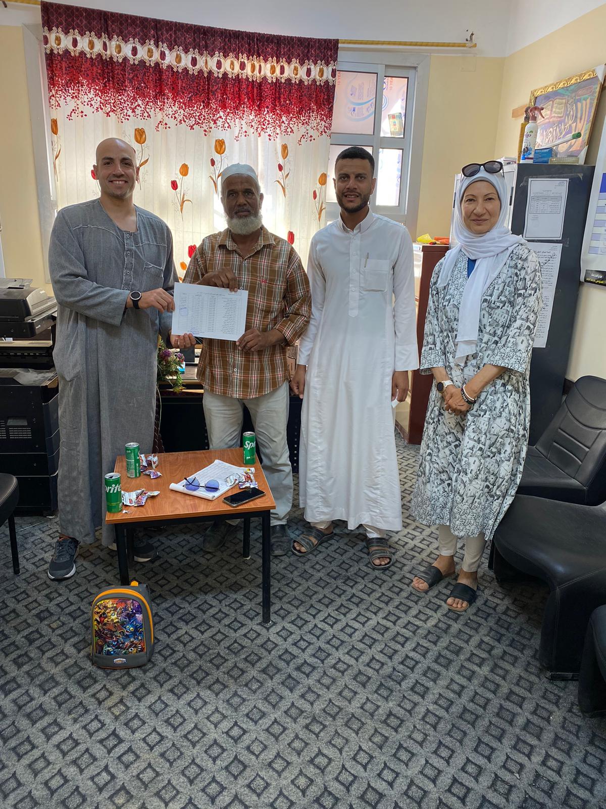 With the principal of the school holding a list of students with outstanding school fees paid by Salsabeel Charity